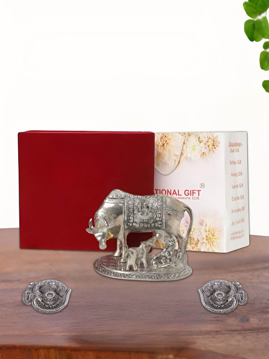 INTERNATIONAL GIFT Kamdhenu Cow with 2 Diya, Velvet Box and Carry Bag Silver Metal Metallic Prayer Room Medium Showpiece - 6.5 Inches