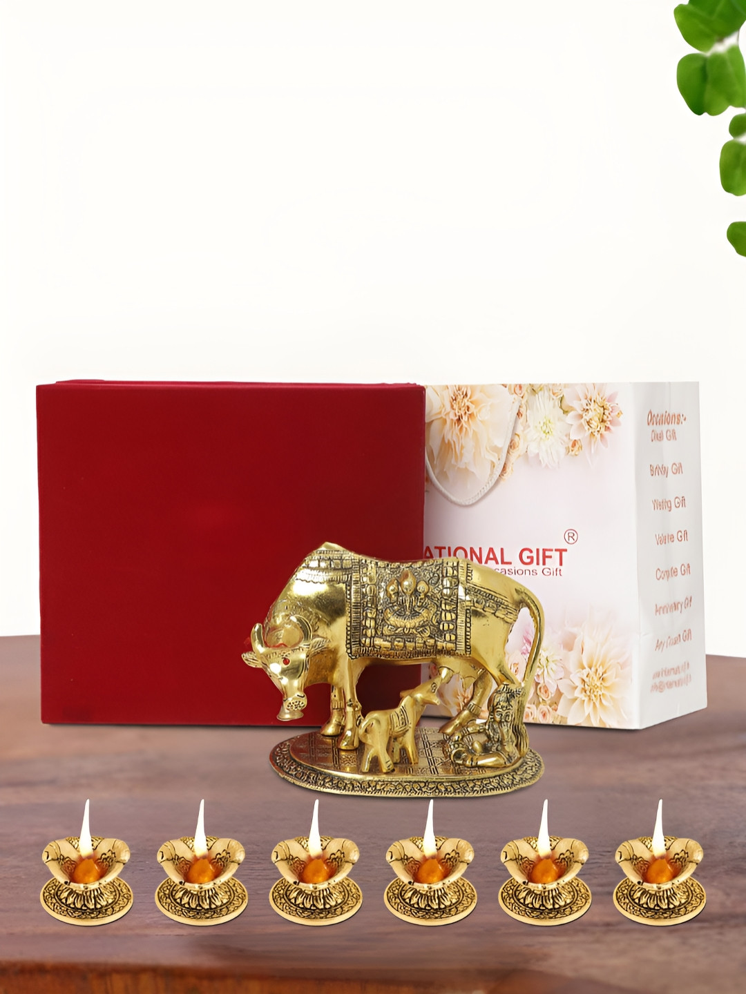 INTERNATIONAL GIFT Kamdhenu Cow with 6 Diya, Velvet Box and Carry Bag Gold Metal Metallic Prayer Room Medium Showpiece - 6.5 Inches