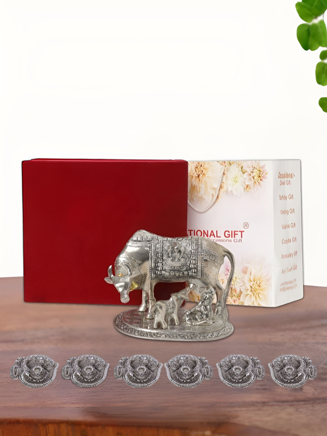 INTERNATIONAL GIFT Kamdhenu Cow with 6 Diya, Velvet Box and Carry Bag Silver Metal Metallic Prayer Room Medium Showpiece - 6.5 Inches