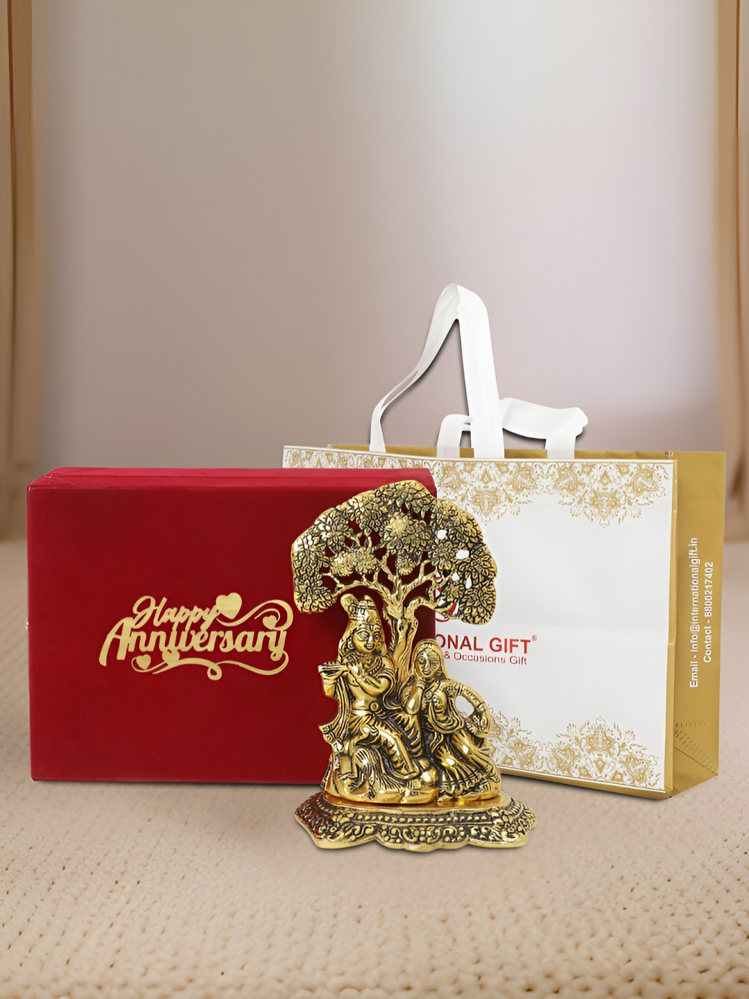 INTERNATIONAL GIFT Radha Krishna with Box, Bag and 'Happy Anniversary' Personalized Tag Gold Metal Metallic Prayer Room Medium Showpiece - 3.5 Inches