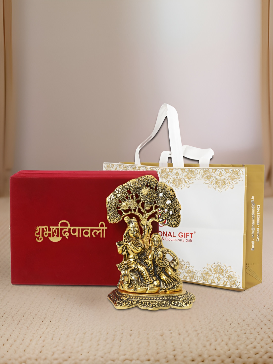 INTERNATIONAL GIFT Radha Krishna with Box, Bag and 'Happy Diwali' Personalized Tag Gold Metal Metallic Prayer Room Medium Showpiece - 7 Inches