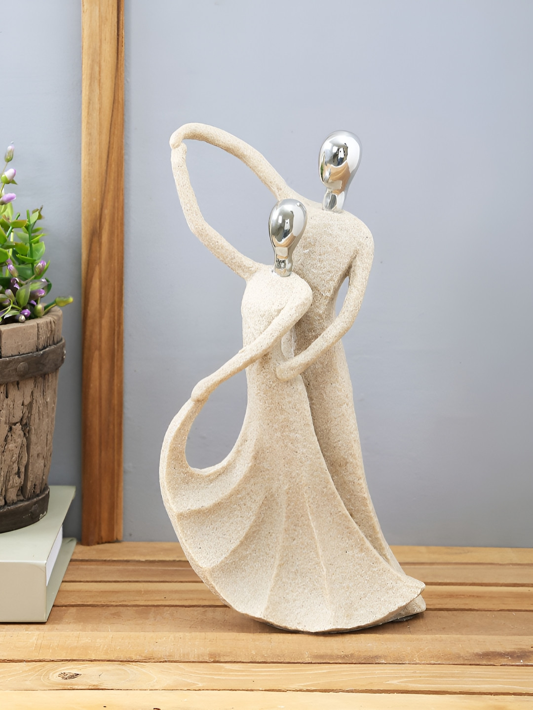 Myntra Elegant Homes Love Couple Silver Polyresin Natural Living Room Medium Showpiece - 11 Inches
