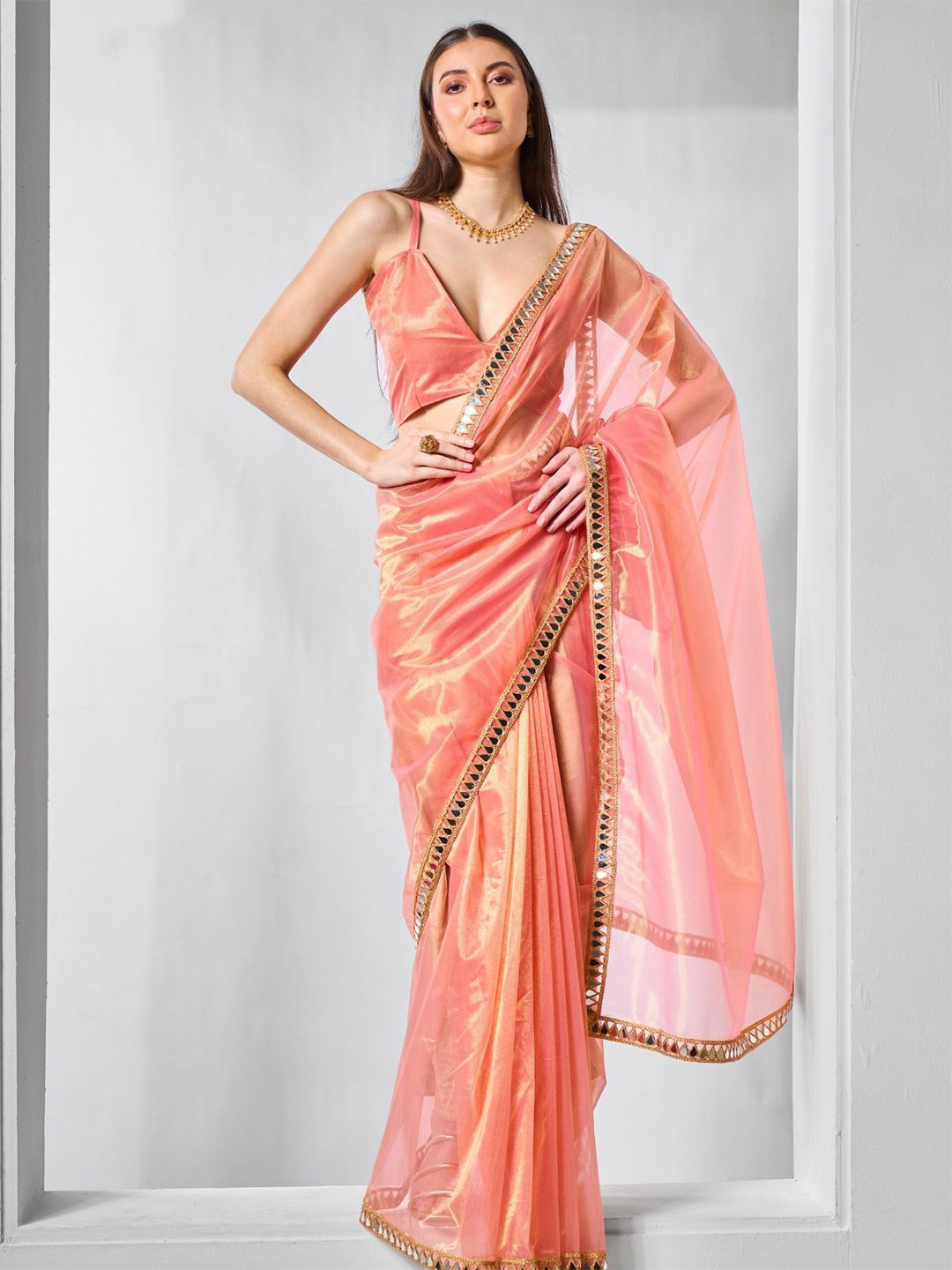 ODETTE Orange Net Solid Saree With Unstitched Blouse For Women