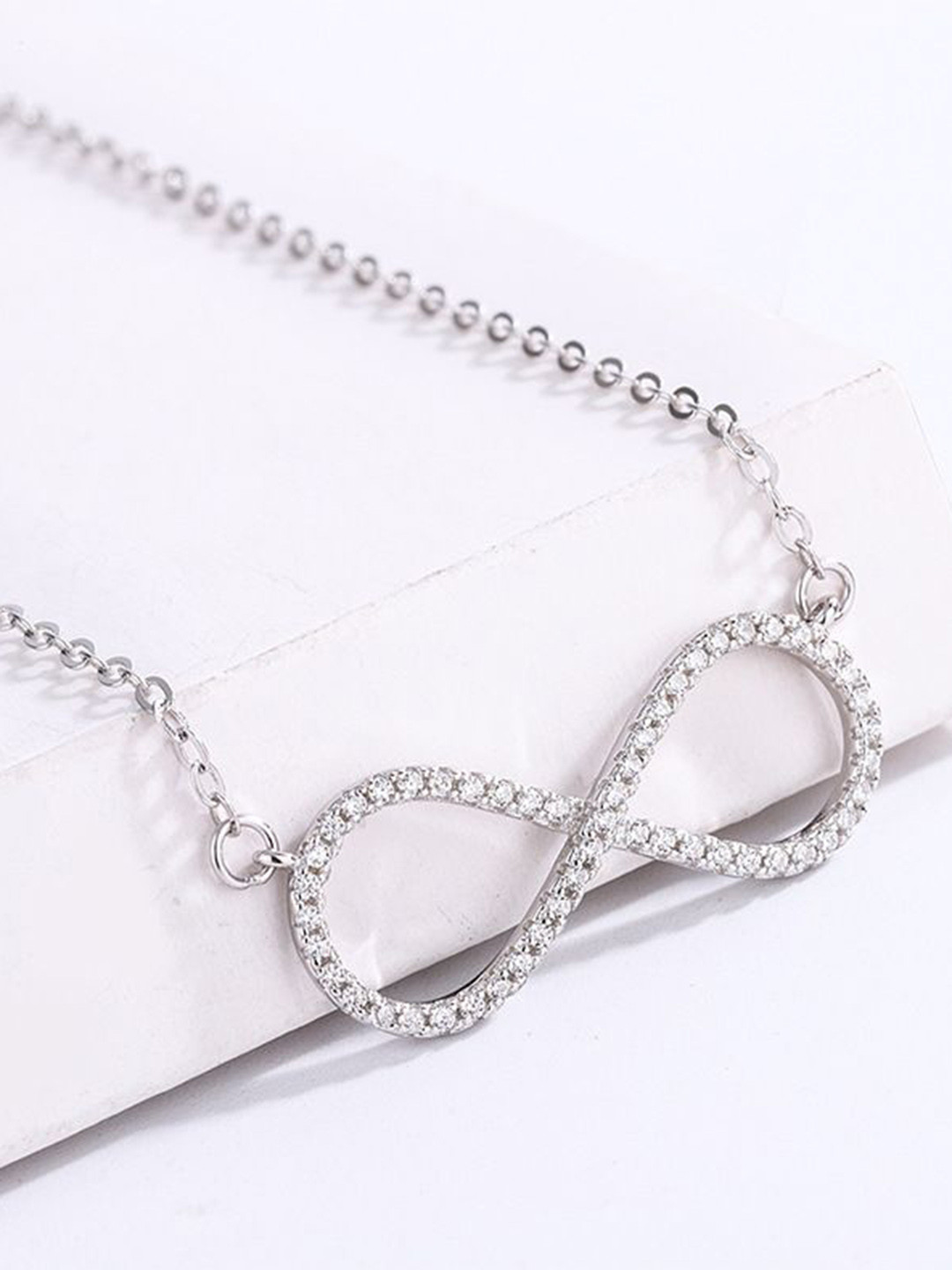 DIVASTRI Stainless Steel Silver-Plated CZ Studded Infinity Shaped Pendants With Chains