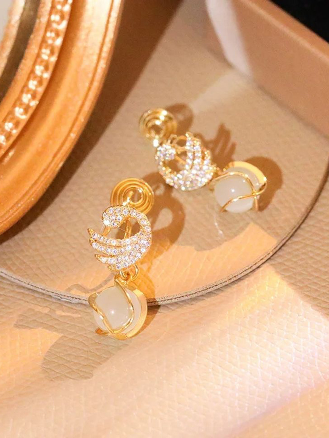 CelestiqueArtificial Swan Stones Studded Opal Beaded Contemporary Shaped Drop Earrings