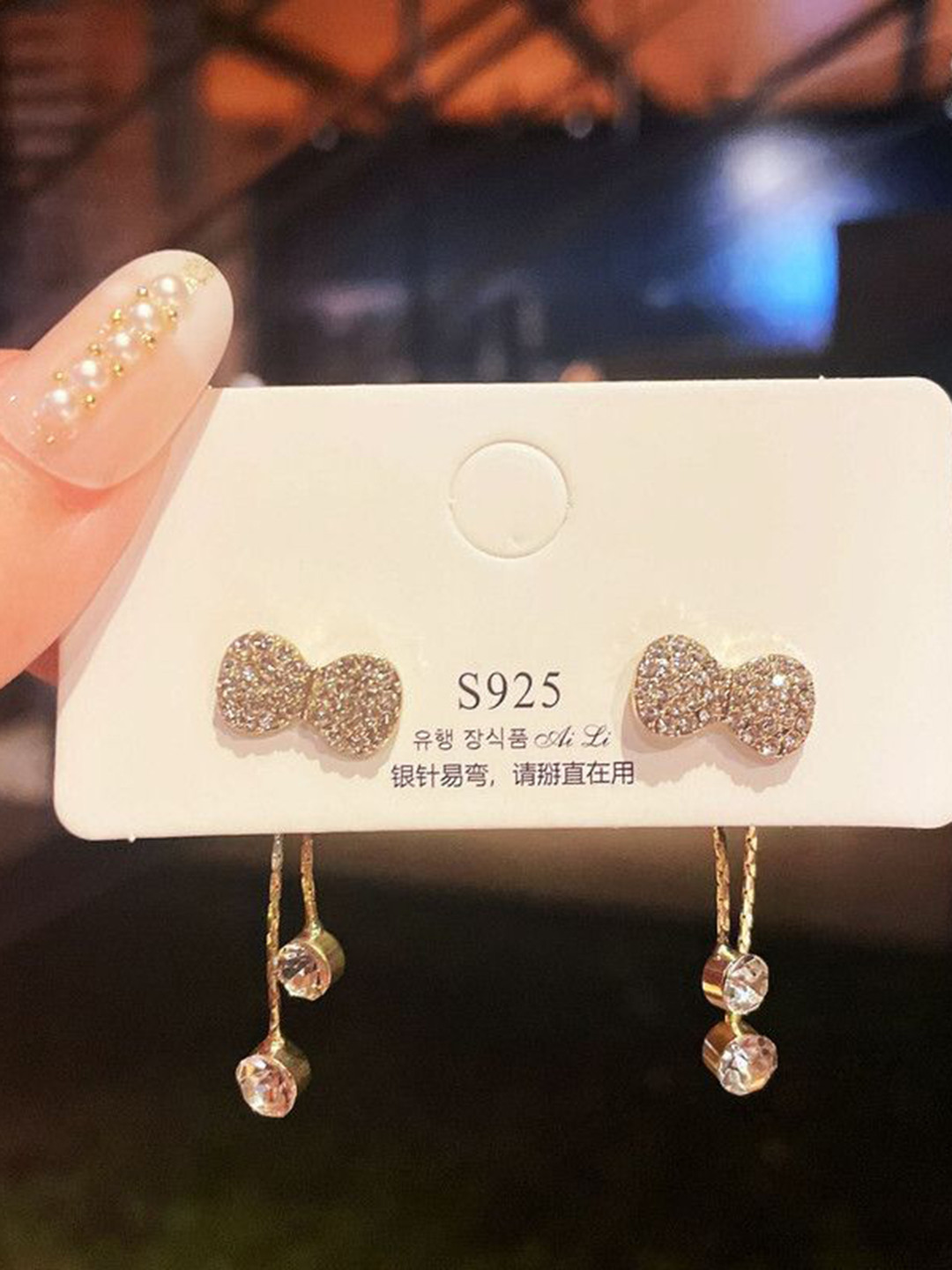 Celestique Artificial Stone Studded Contemporary Bowknot Tassel Sweet Drop Earrings