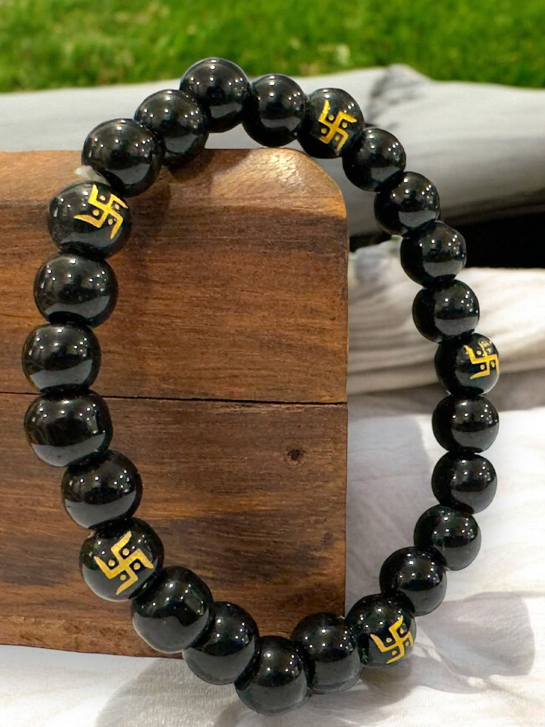 AKLINA Swasthik Printed Onyx Beads Studded Ceramic Elasticated Bracelet