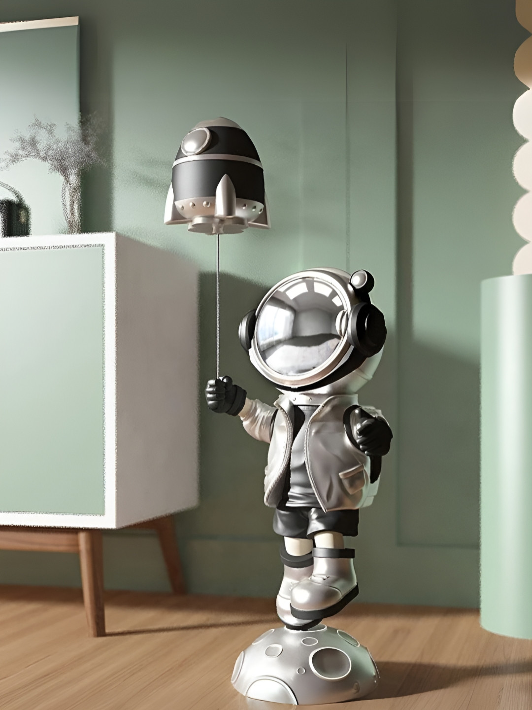 SMOKEY COCKTAIL Astronaut with Rocket Silver Polyresin Glossy Living Room Large Showpiece - 9.8 Inches
