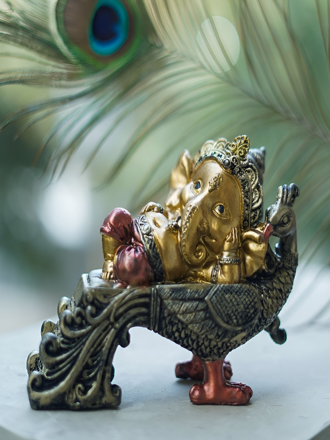 Craftlayout Sitting On Peacock Lord Ganesh Gold Polyresin Metallic Prayer Room Medium Showpiece - 4.7 Inches