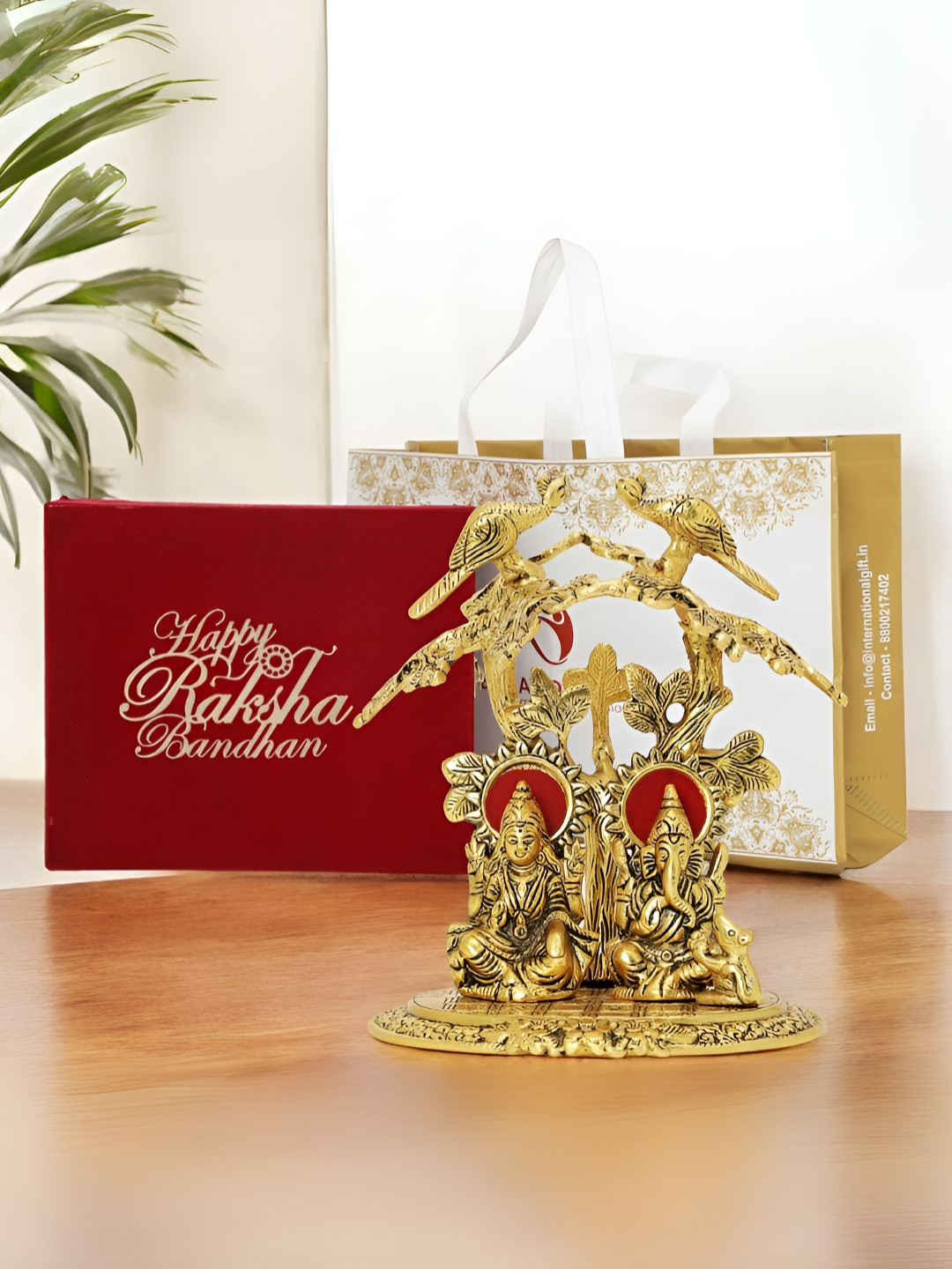 INTERNATIONAL GIFT Laxmi Ganesh with Box, Bag and 'Happy Raksha Bandhan' Tag Gold Metal Metallic Prayer Room Medium Showpiece - 8 Inches