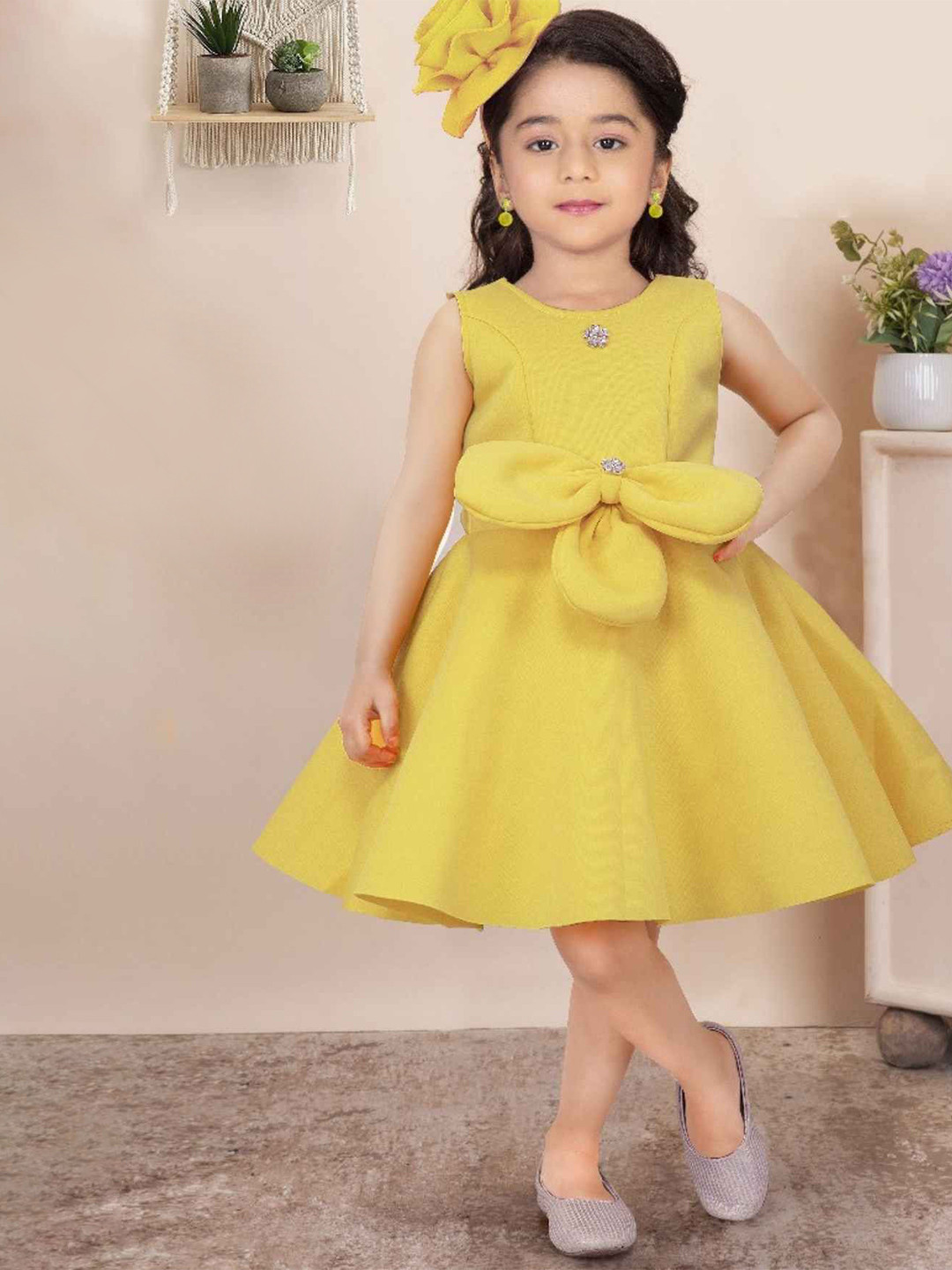 Lagorii Girls Sleeveless Embellished With Bow And Stone Frock Yellow