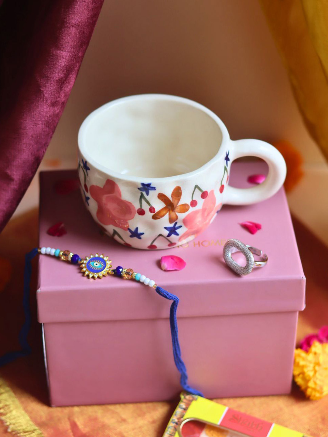 WEAVING HOMES Stone Studded & Beaded Thread Rakhi With Mug & Earrings