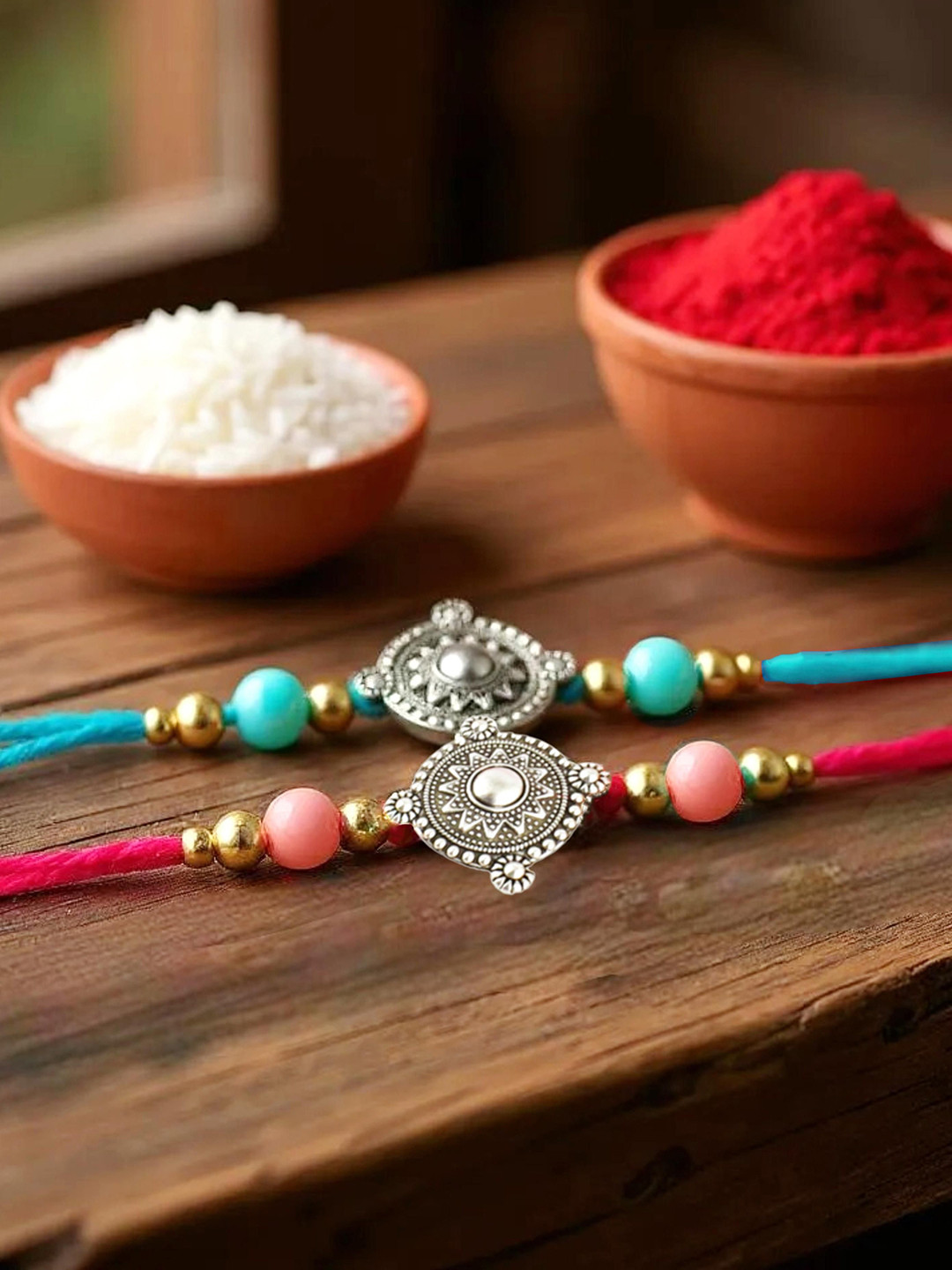 LUCKY JEWELLERY 2-Pcs Silver-Plated Charm Rakhi With Roli, Chawal & Greeting Cards.