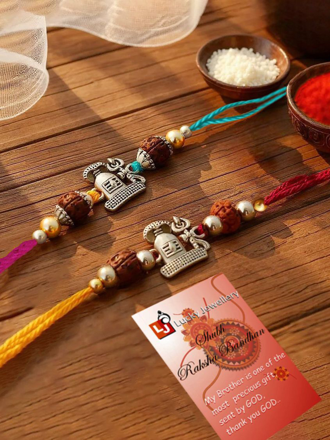 LUCKY JEWELLERY Set Of 2 Religious Charms Thread Rakhis With Greeting Card