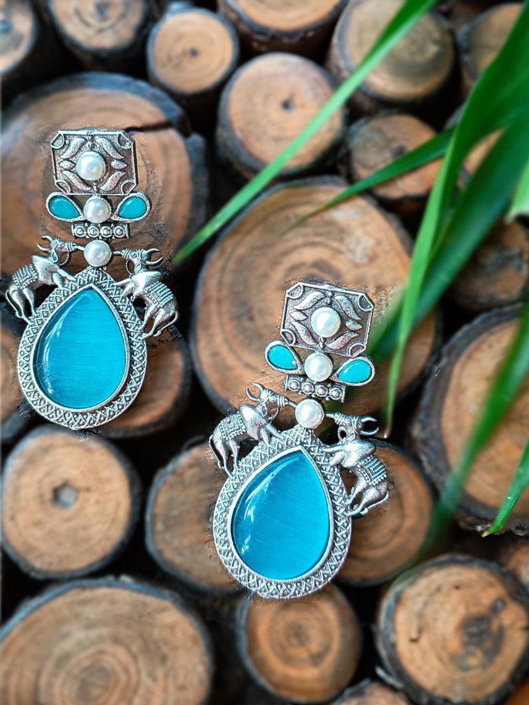 Poush Luxury Artificial Stones Studded Oxidised Teardrop Shaped Drop Earrings