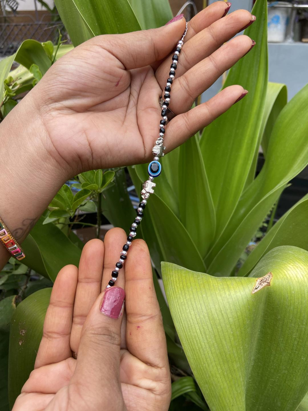 Black Beaded Bracelet with Evil Eye and Elephant Charms