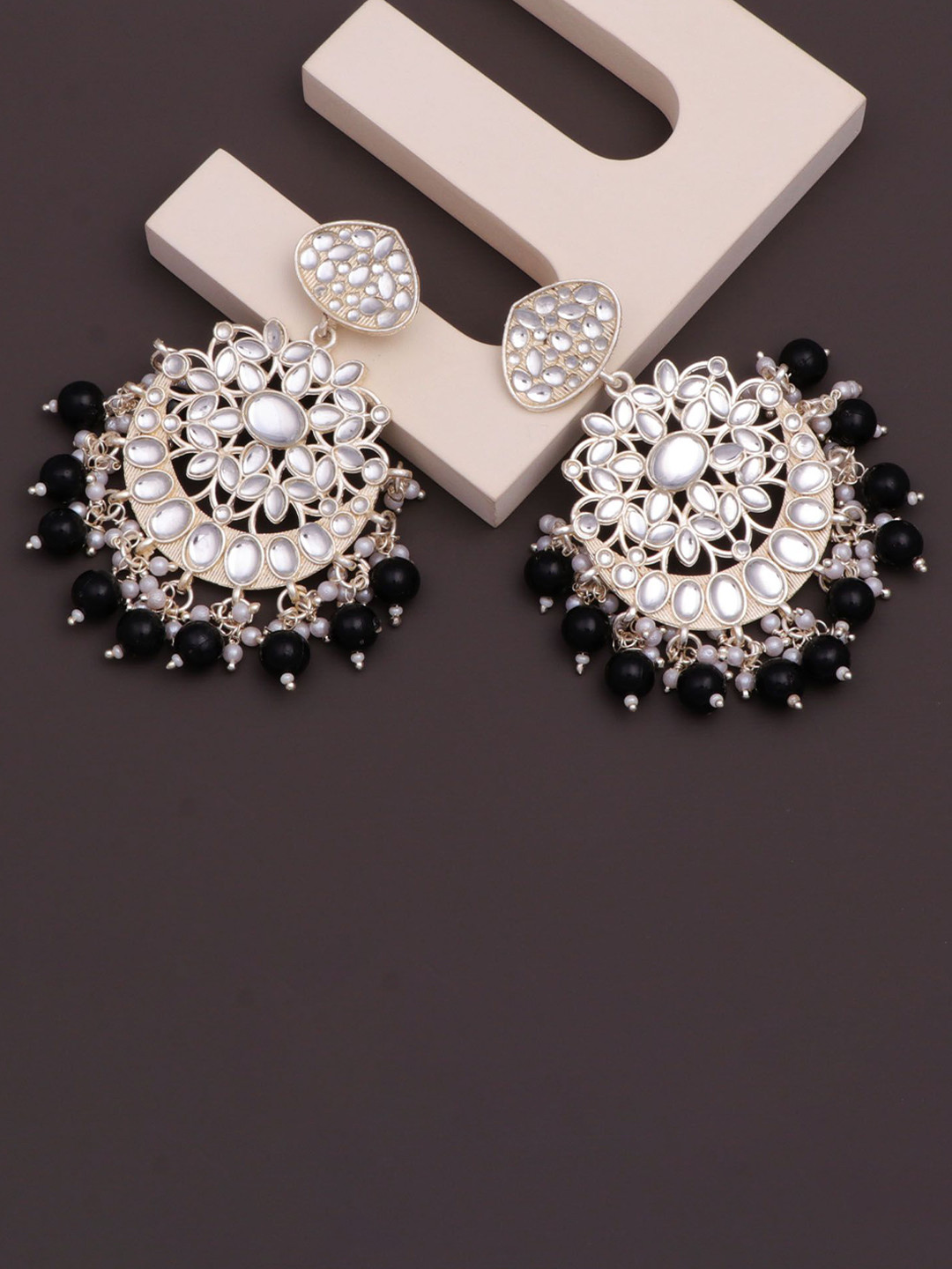 CAPILITE Jewellers Silver-Plated Kundan Studded & Pearl Beaded Crescent Shaped Chandbalis