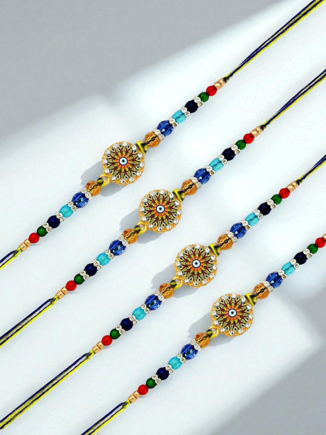 ADIVA Set Of 4 Evil Eye CZ Studded & Beaded Rakhi With Pooja Thali & Roli Chawal