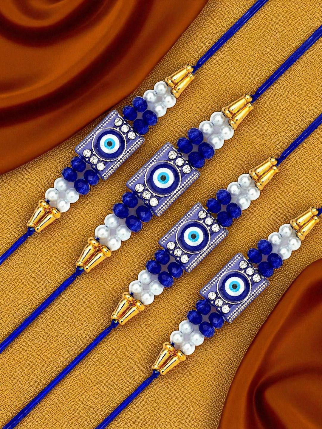 ADIVA Set Of 4 CZ Studded & Beaded Evil Eye Thread Rakhis With Roli Chawal Chandan & Card