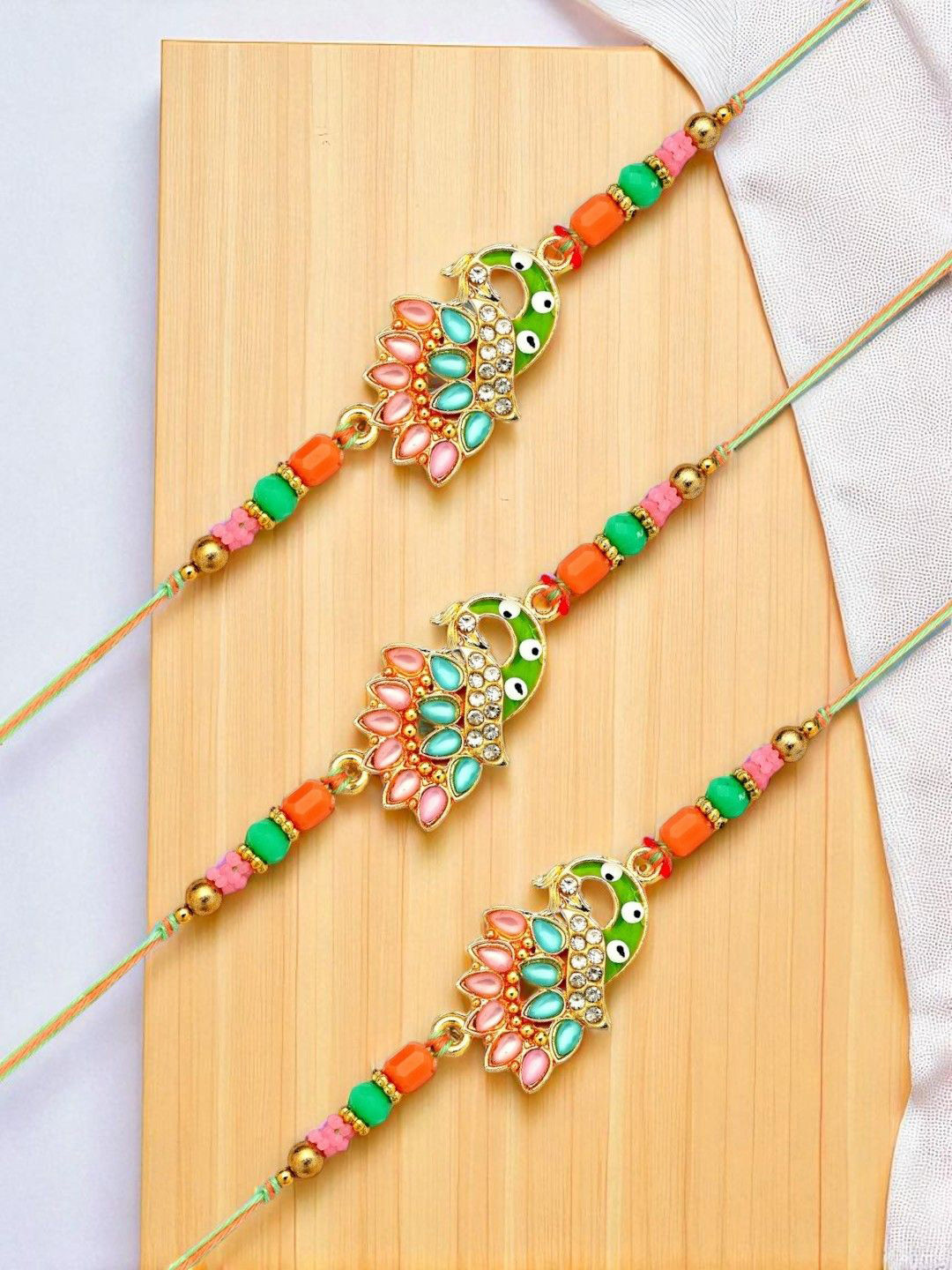 ADIVA Set of 3 Gold-Plated Beaded Thread Rakhi With Pooja Thali & Roli Chawal Bag Gift Set