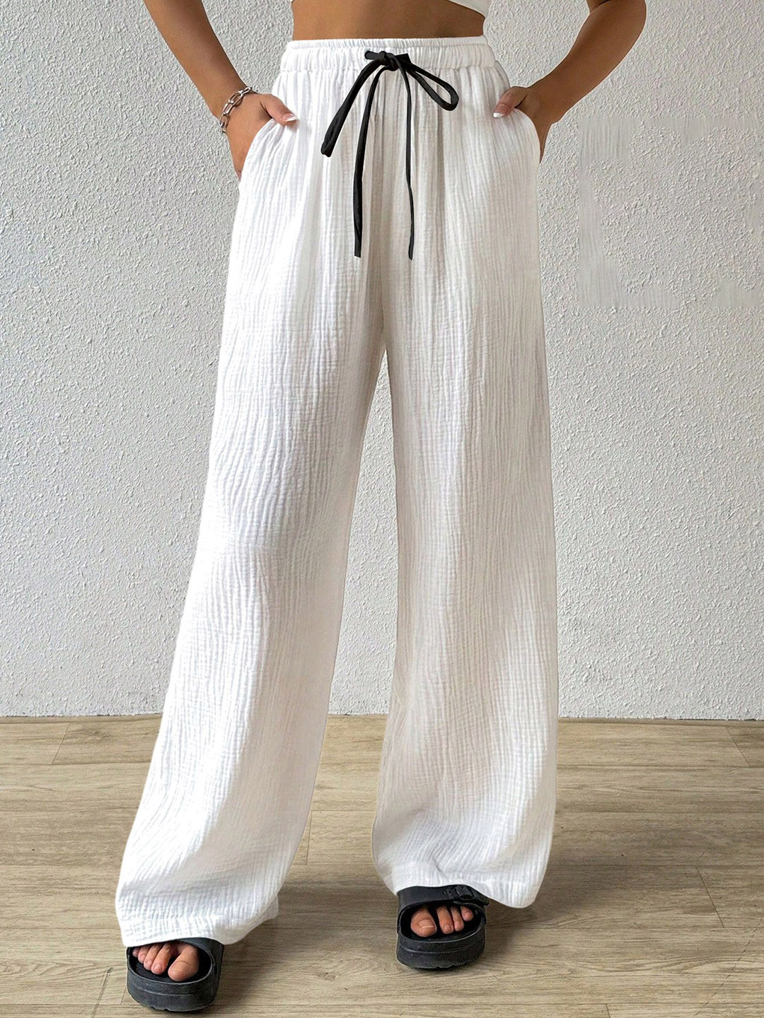 RAJOVATI Women Self Design Loose Fit High-Rise Side Pocket Trousers