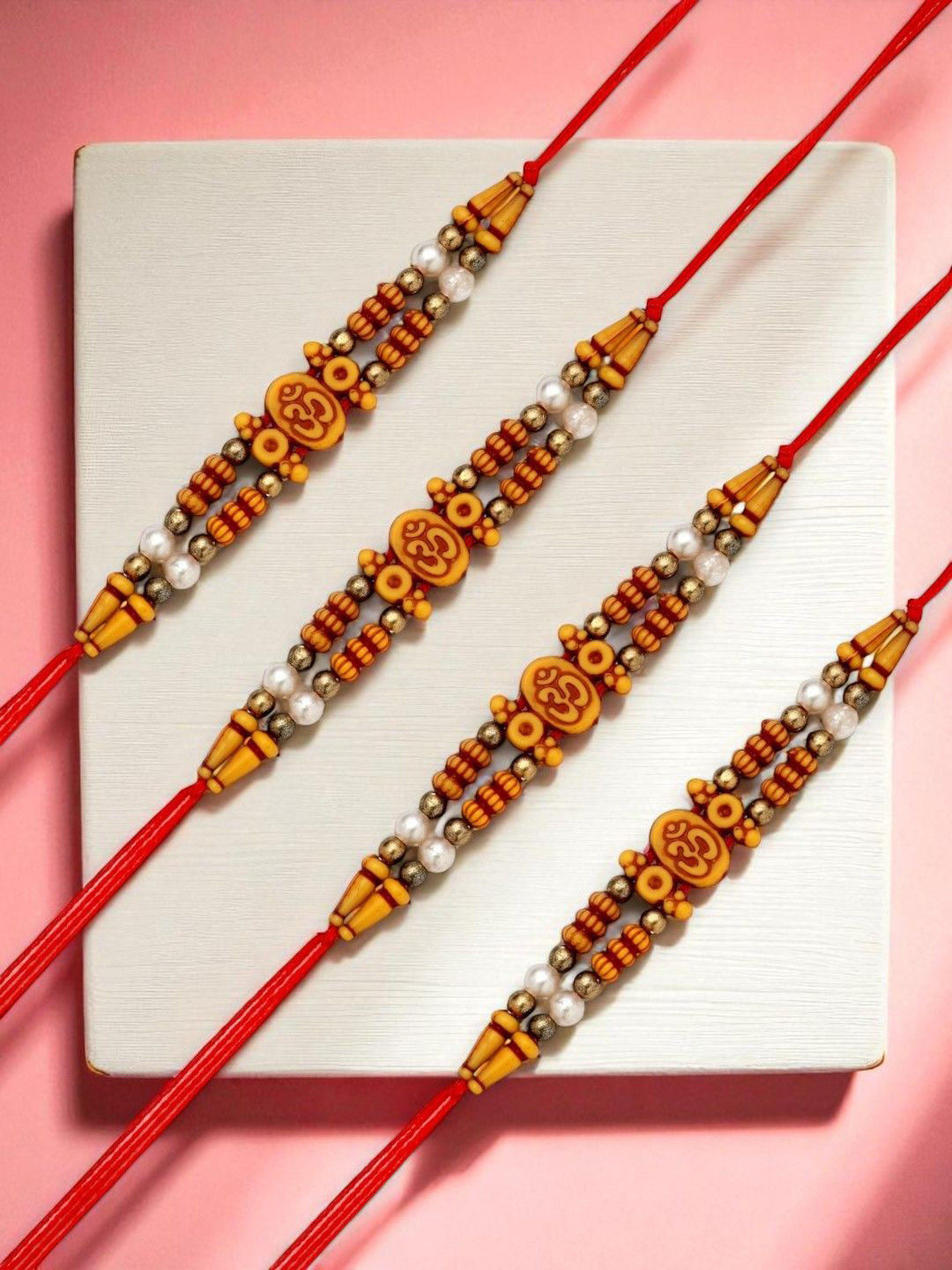 ADIVA Set Of 4 Sones Studded & Beaded Om Rakhis Roli Chawal & Greetings Card