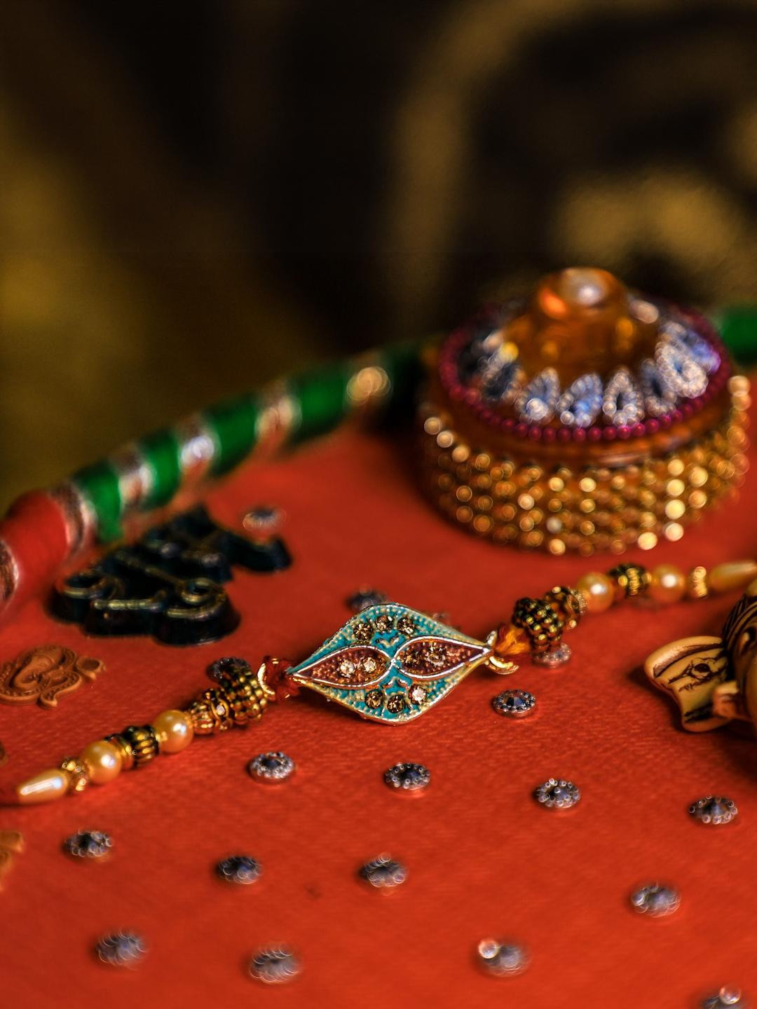 TOS Stone Studded And Beaded Thread Rakhi With Roli Chawal