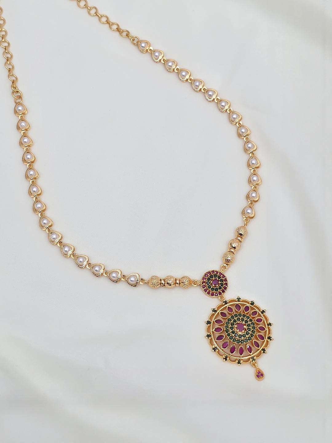 Gold-Plated Necklace with Pearl Accents and Intricate Pendant Design
