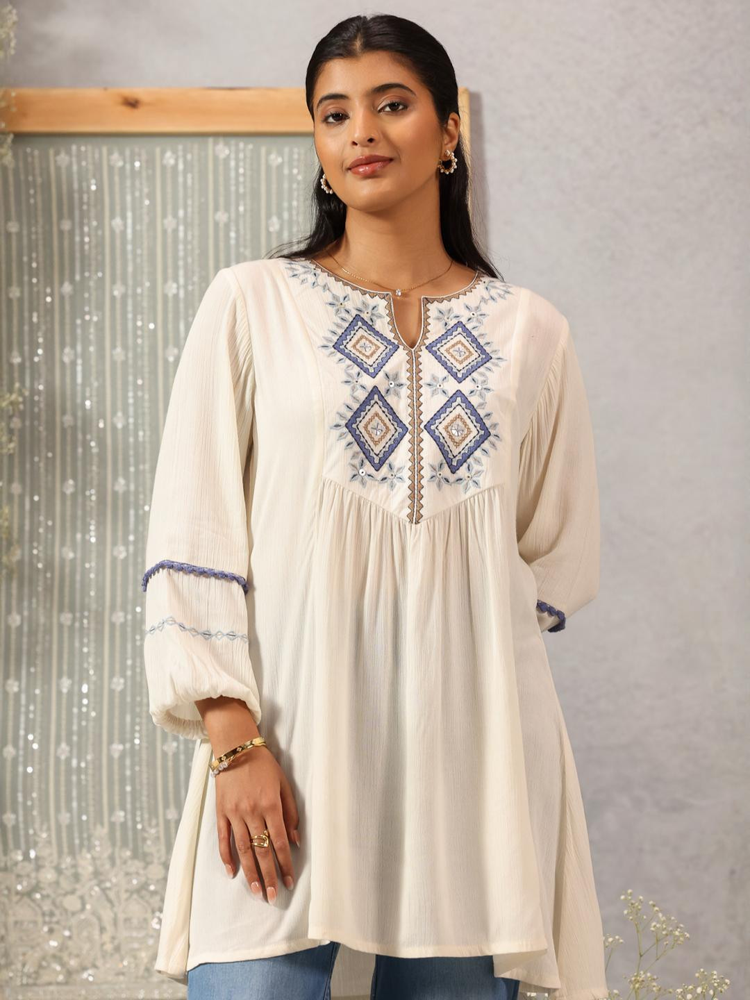 Lakshita Off White Thread Embroidered Rayon Top