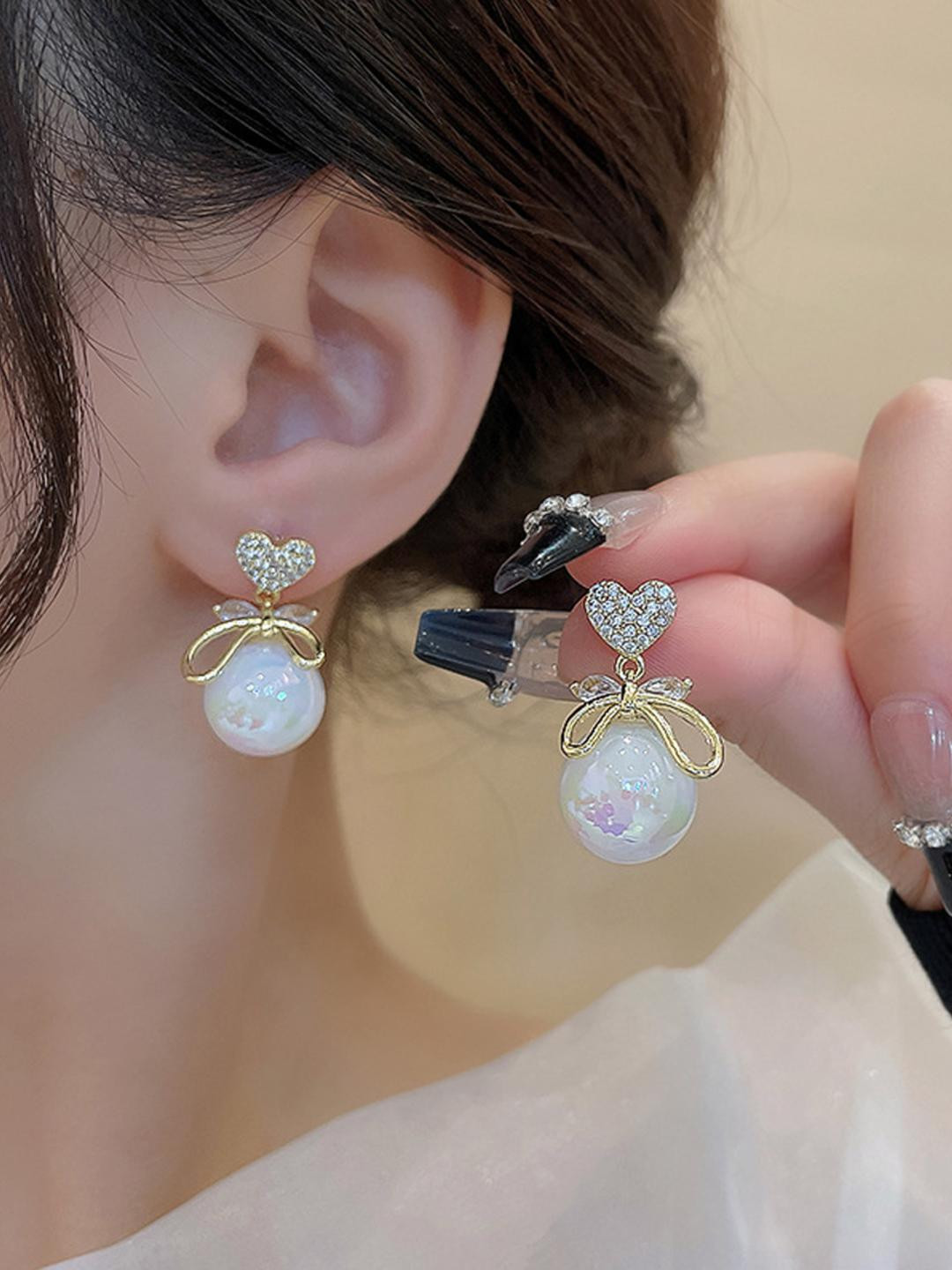 heVineGirl Korean Studded Bow Heart Big Pearl Drop Earrings For Women