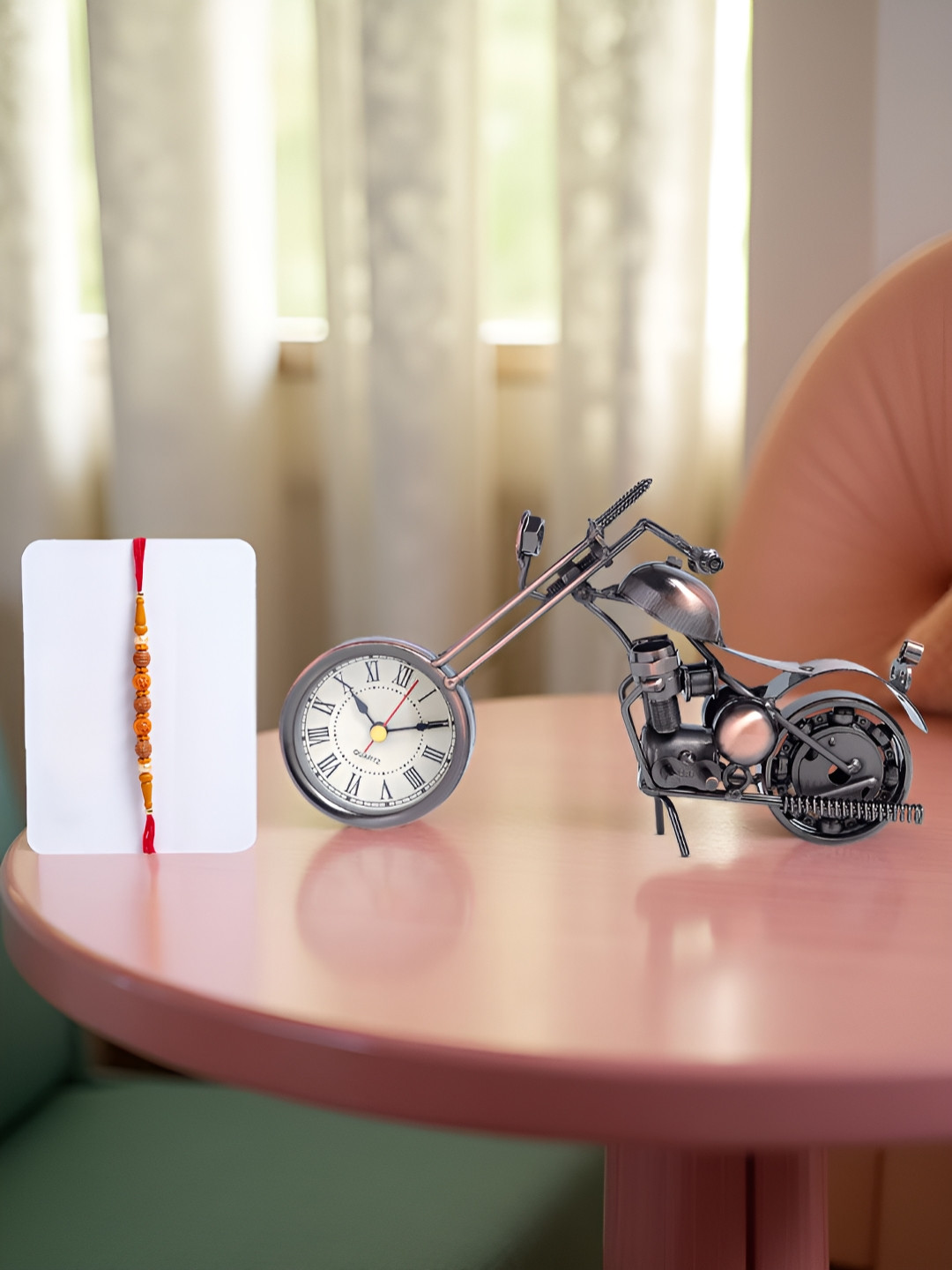 Golden Peacock Stones Studded And Beaded Rakhi With Bike Shaped Table Clock