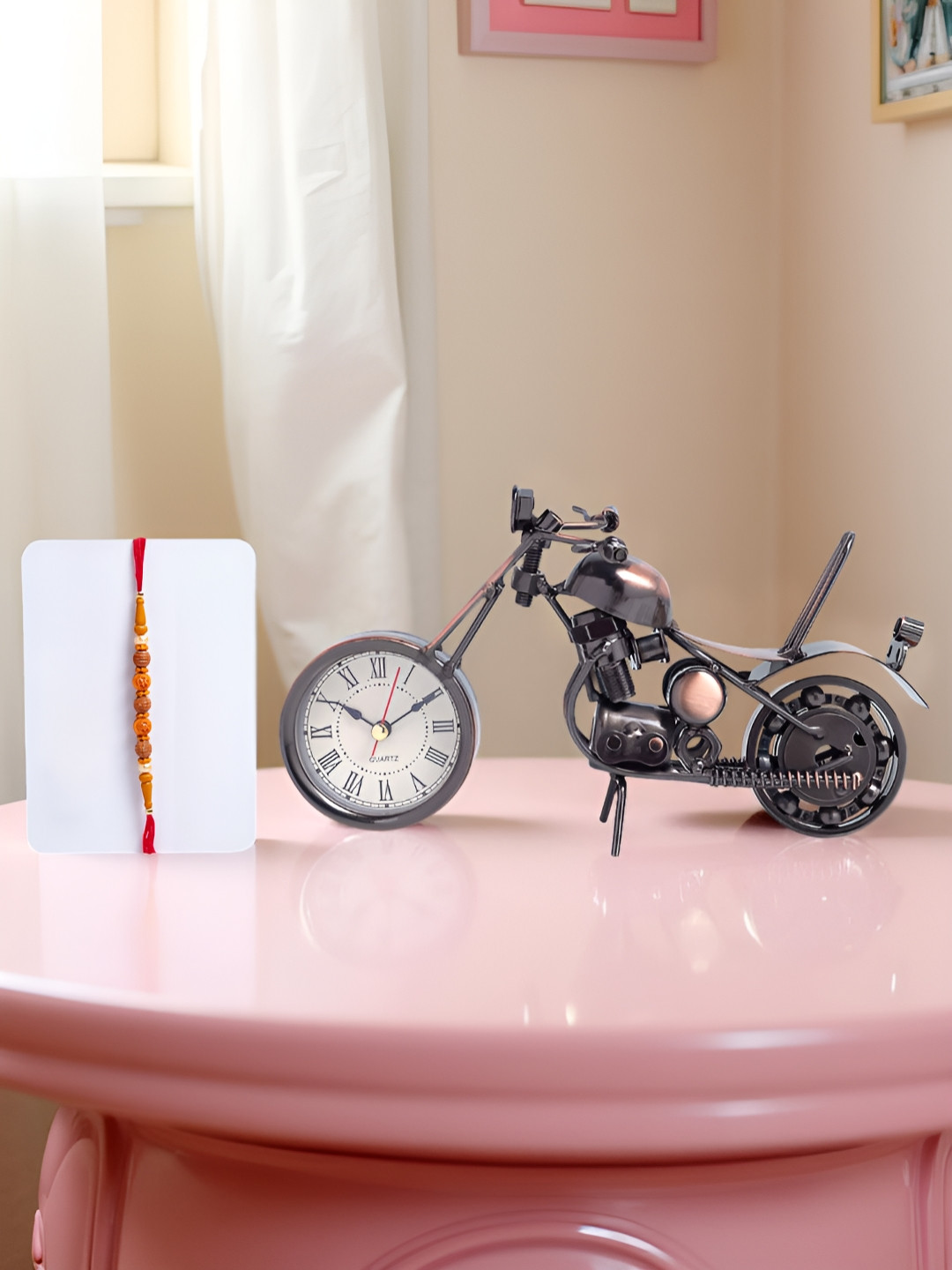 Golden Peacock Stones Studded And Beaded Rakhi With Bike Shaped Table Clock