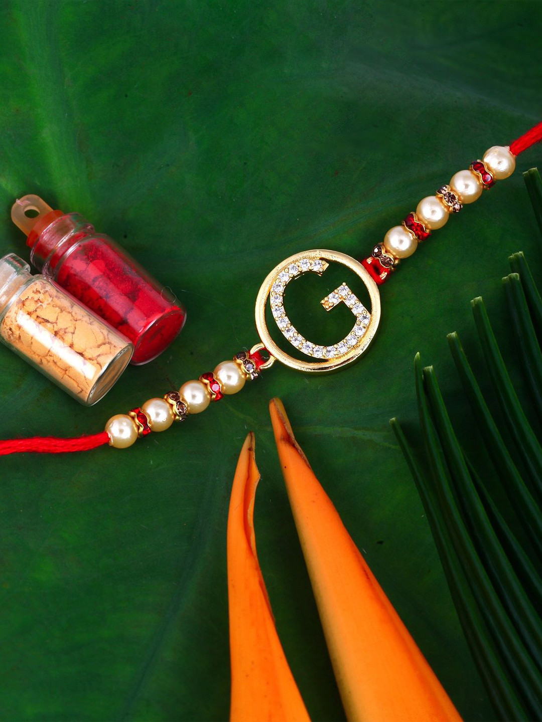 Vighnaharta Gold Plated Cubic Zirconia Studded G Alphabet Thread Rakhi