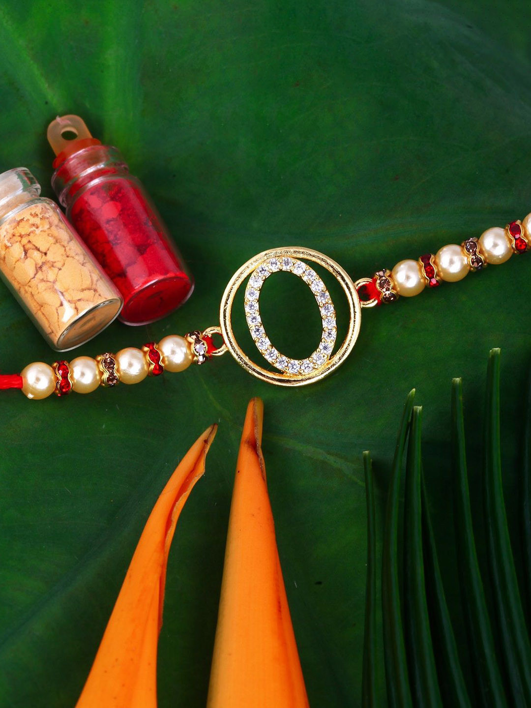 Vighnaharta Gold Plated Cubic Zirconia Studded O Alphabet Thread Rakhi