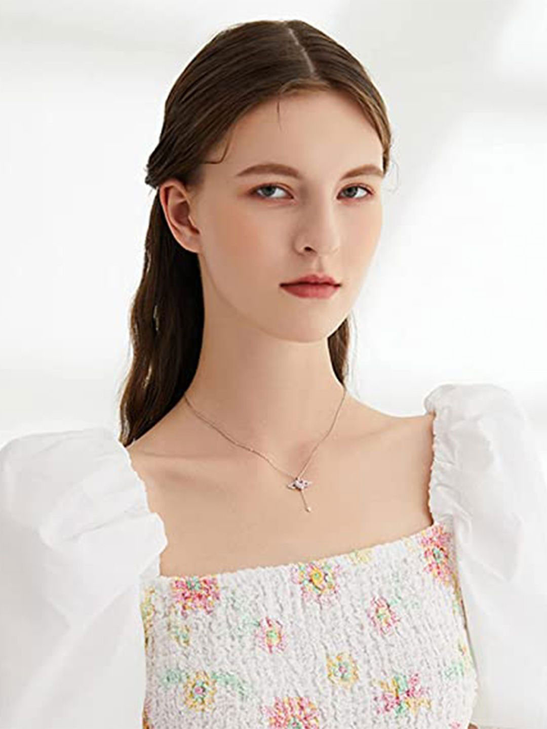 Winnifred Silver-Plated American Diamond-Studded Latkan Angel Wing Pendant With Chain