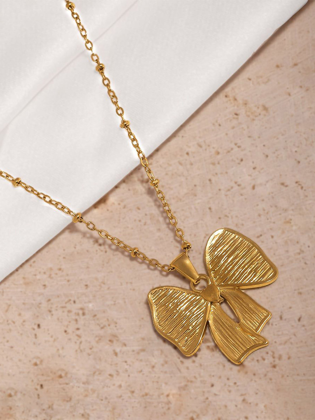 Estailo fashion  Women Gold-Plated Sweet Bow Belle Pendant With Chain