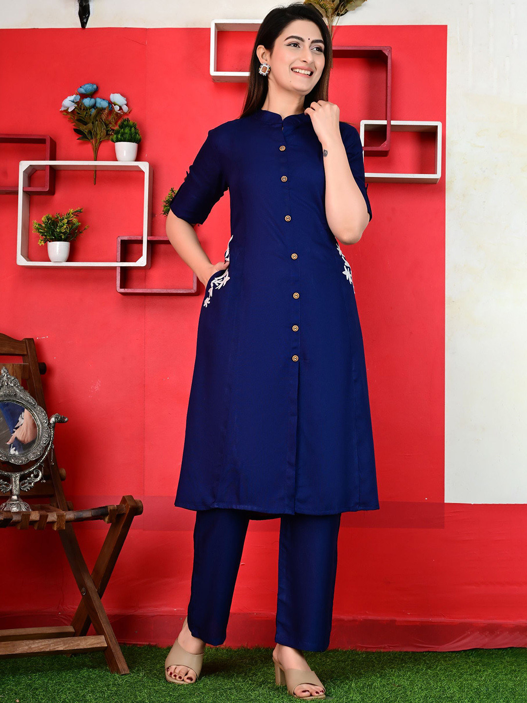 Uroos Women Solid Embroidered Kurta with Trousers