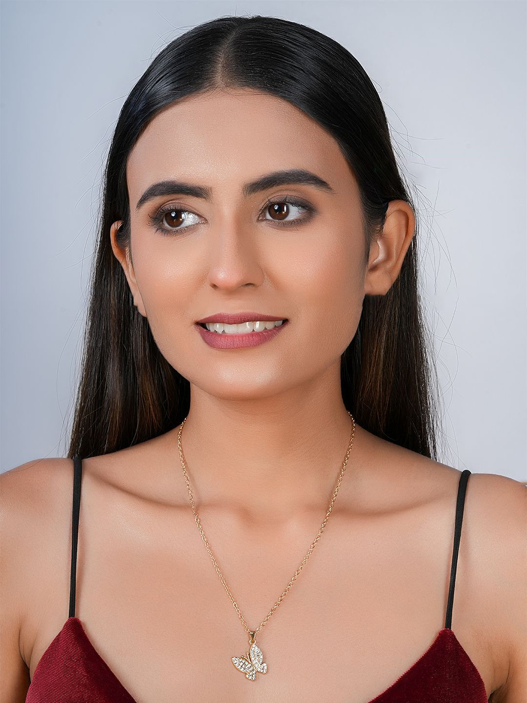 STYOLLO Gold-Plated Artificial Stones Studded Butterfly Shaped Pendant With Chain