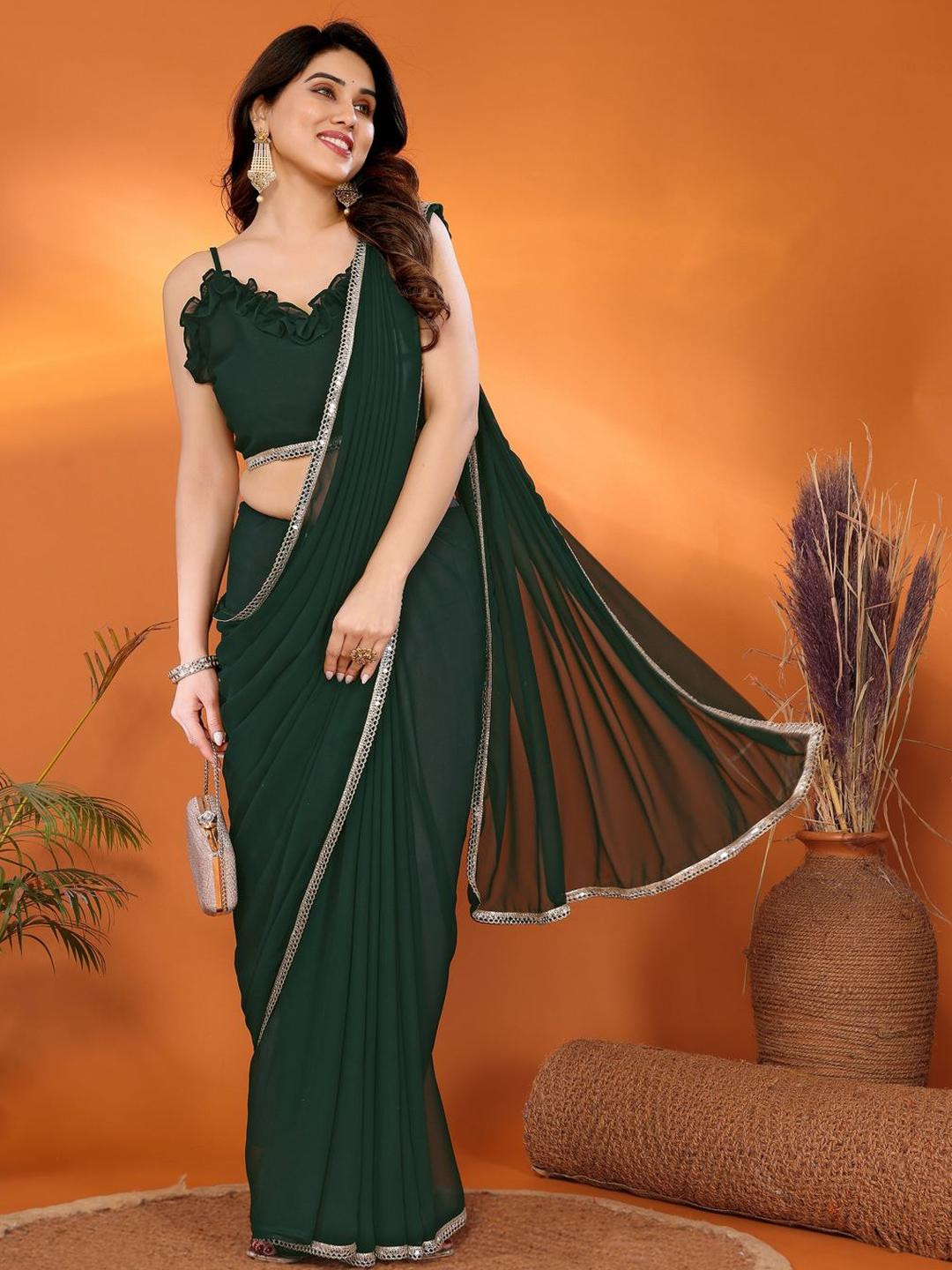 SILKWEAR  Women Solid Pure Georgette Saree With Mirror Work Border