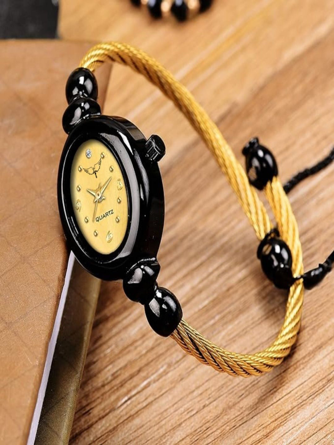 WHITE BIRD Women Brass Oval Dial Analogue Watch W.Kadu Black & Gold