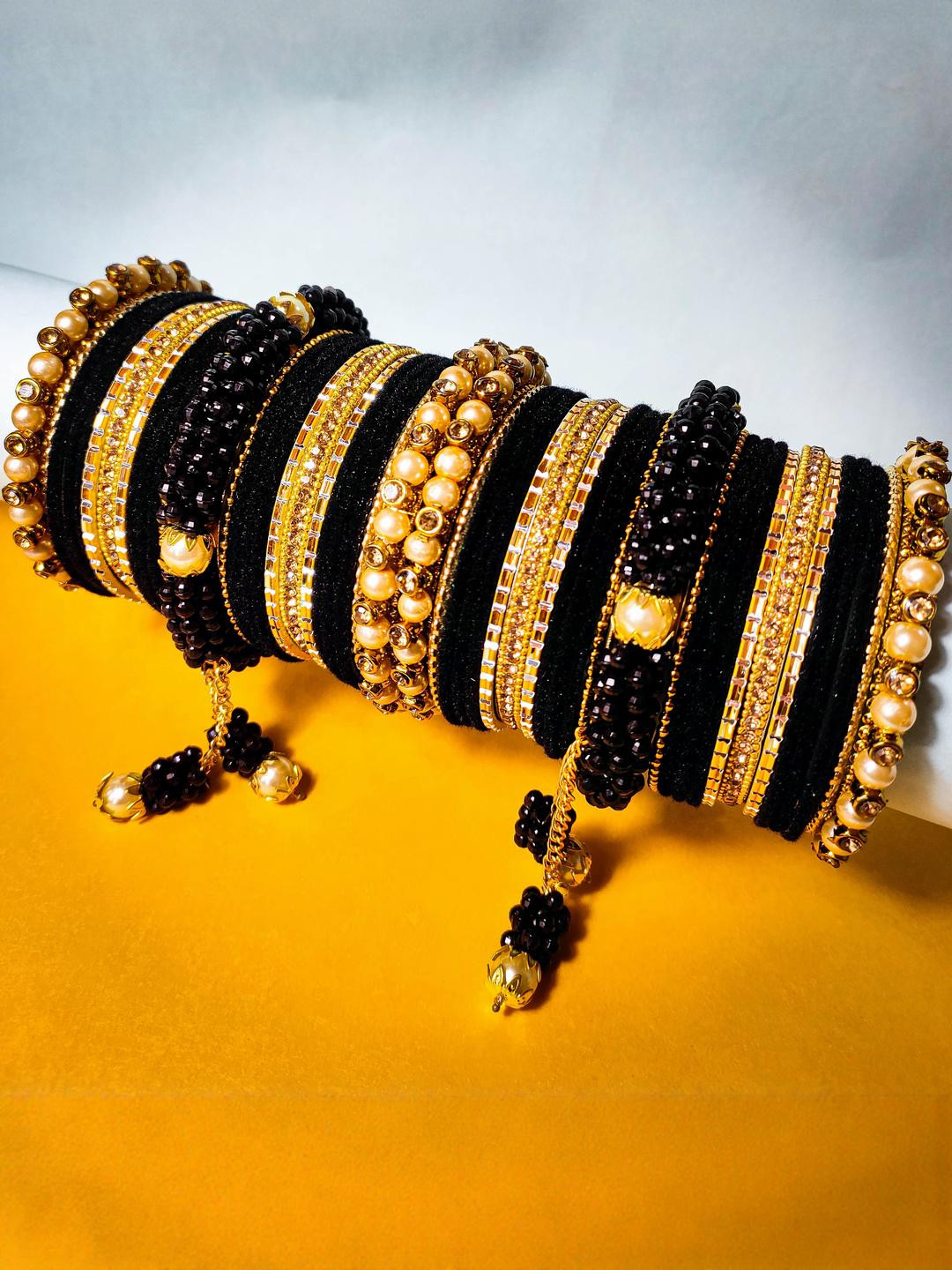 Amika Gold-Plated & Black Alloy Artificial Stones & Beads Bangles