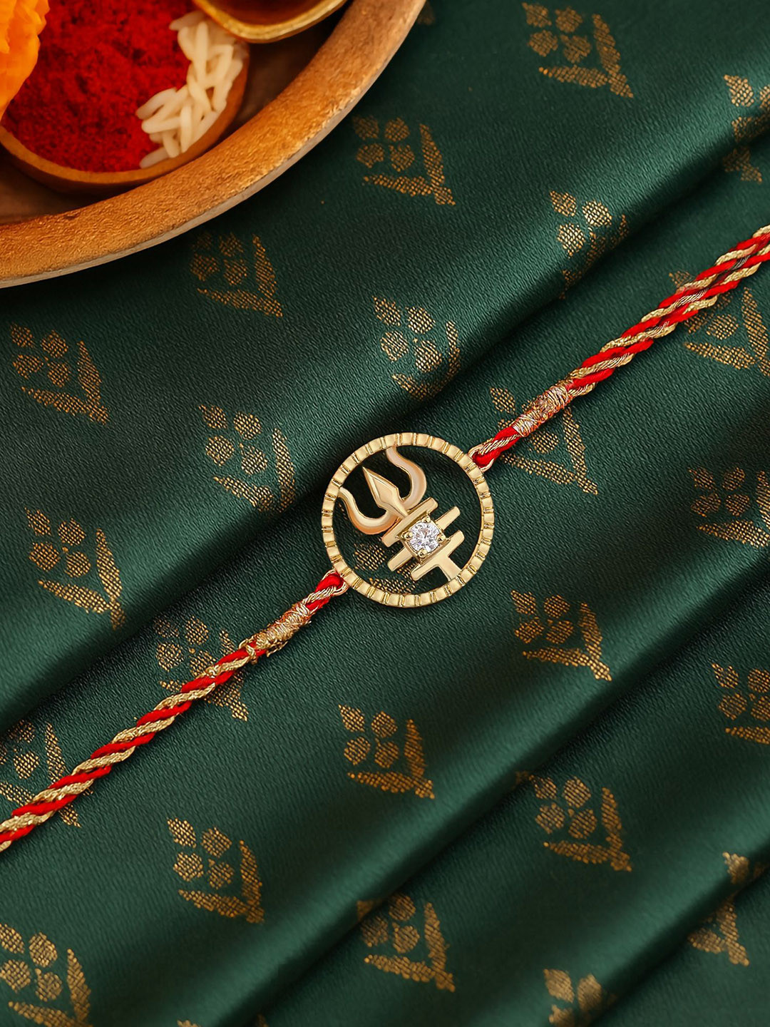 Ornate Jewels 18K Gold Plated American Diamond Trishul Rakhi With Roli Chawal