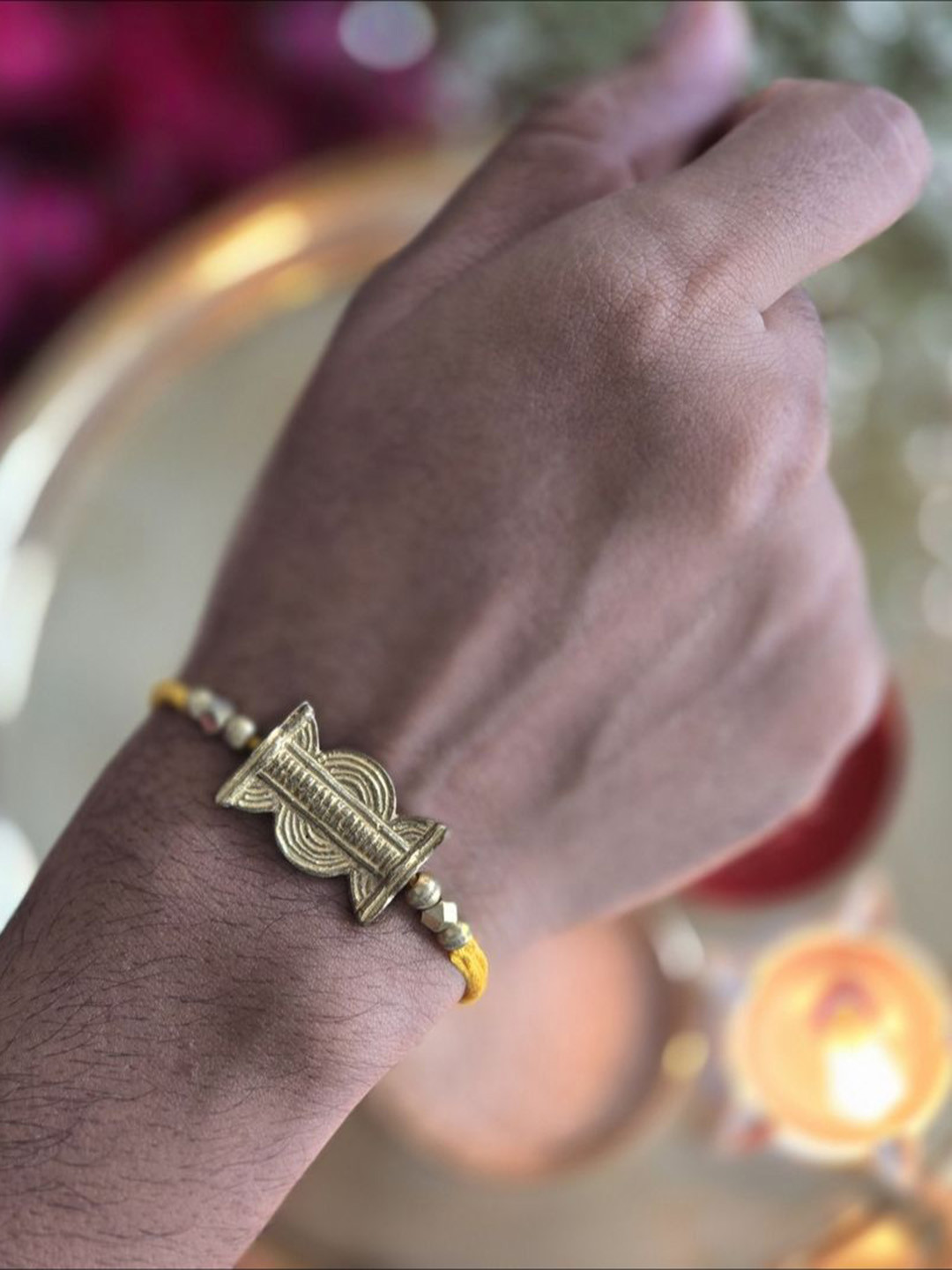 Studio Anviksha Sun spot brass Charm Rakhi