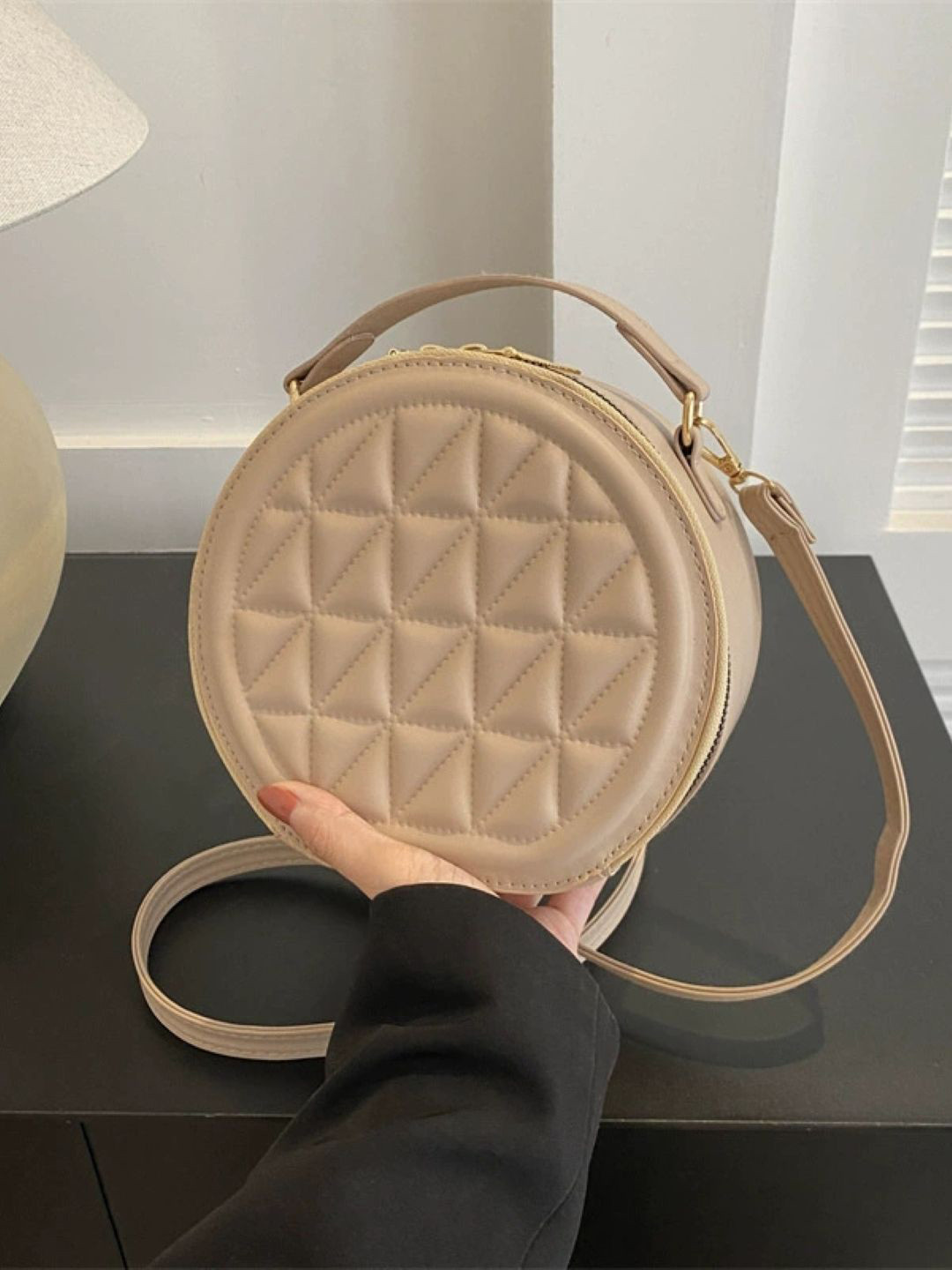 StyleCast Textured Quilted Round Structured Sling Bag
