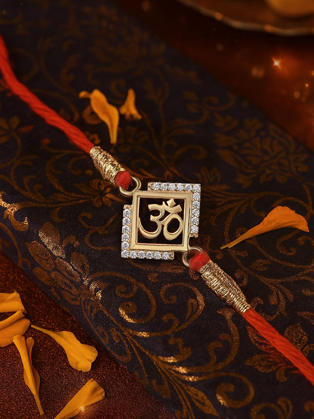 Ornate Jewels 18K Gold Plated American Diamond Divine Om Rakhi With Roli Chawal