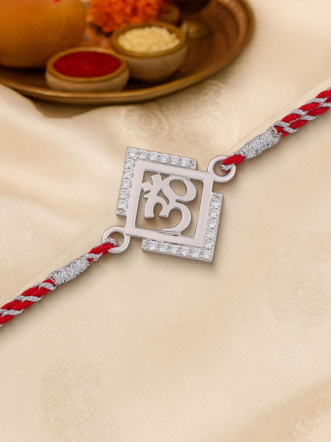 Ornate Jewels 925 Silver American Diamond Divine Om Rakhi With Roli Chawal