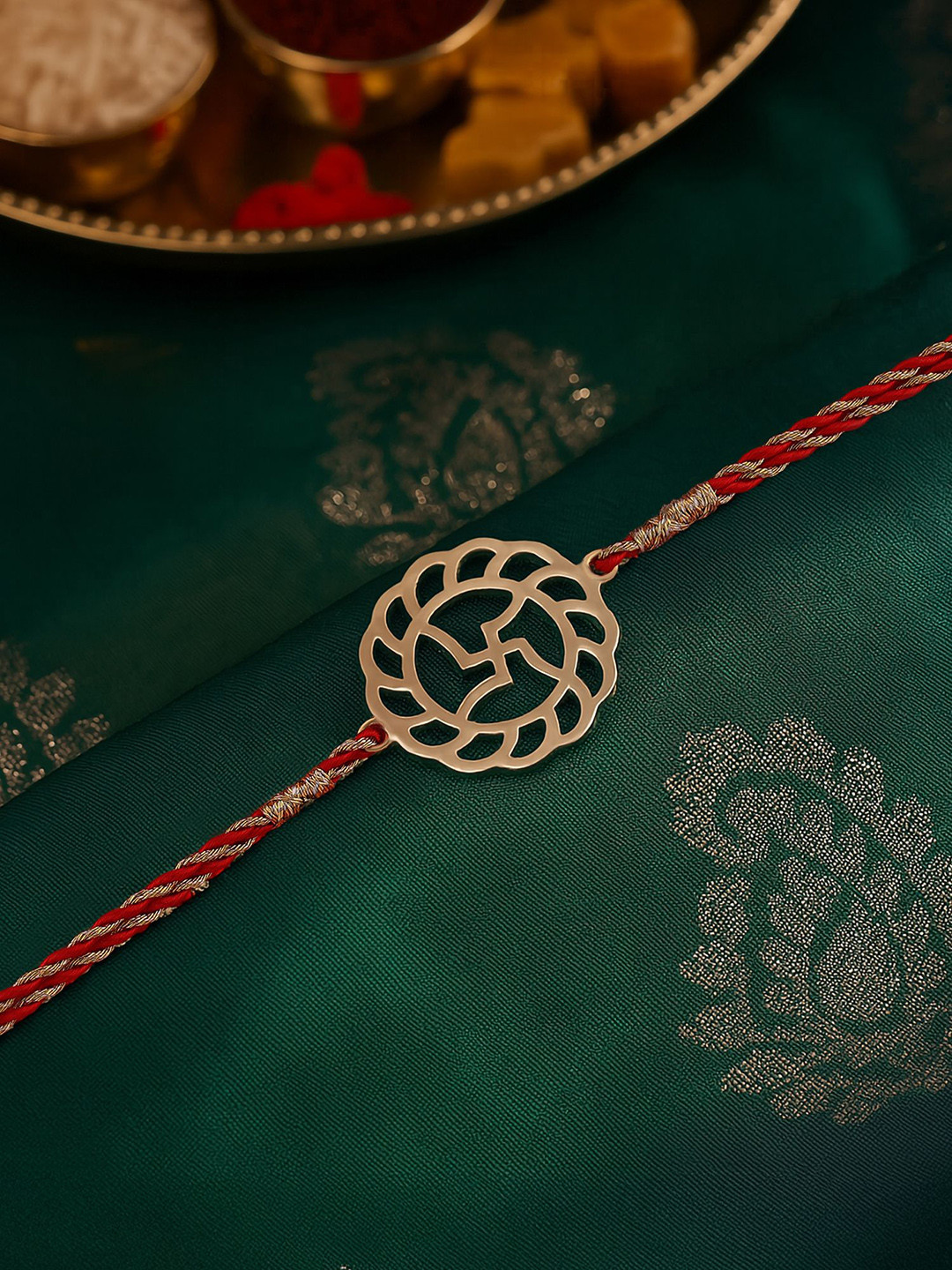 Ornate Jewels 18K Gold Plated Swastik Rakhi With Roli Chawal