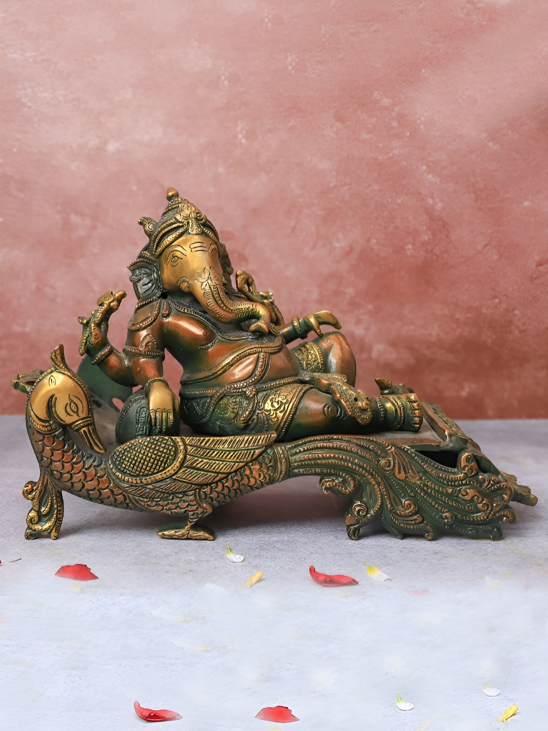 The Advitya Gold-Toned Religious Antique Ganesha Resting On Peacock Couch Idol Showpiece