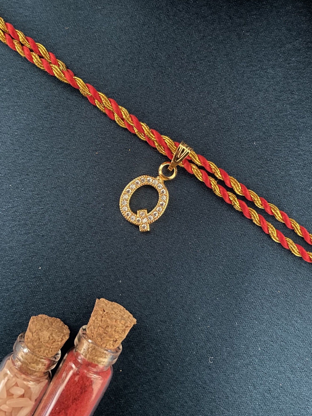 Digital Dress Room Gold Plated Q Alphabet AD Studded Initial Thread Rakhi