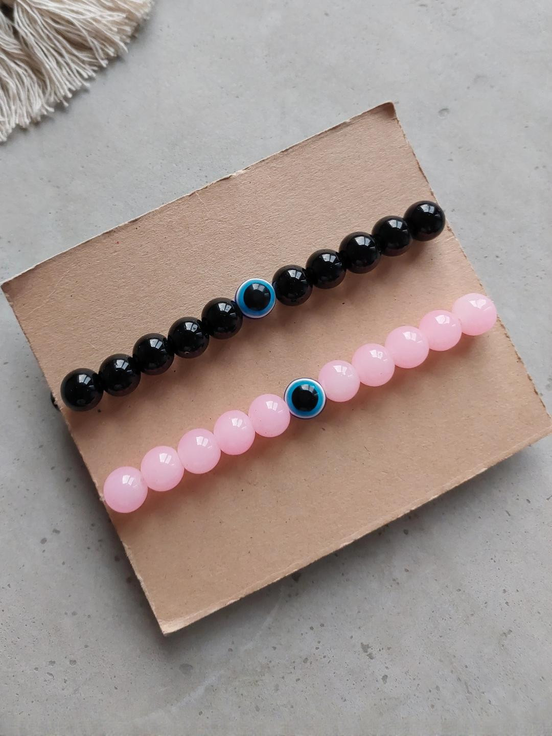 Rodya Unisex Set Of 2 Black & Pink Evil Eye Ceramic Artificial Beads Elasticated Bracelet
